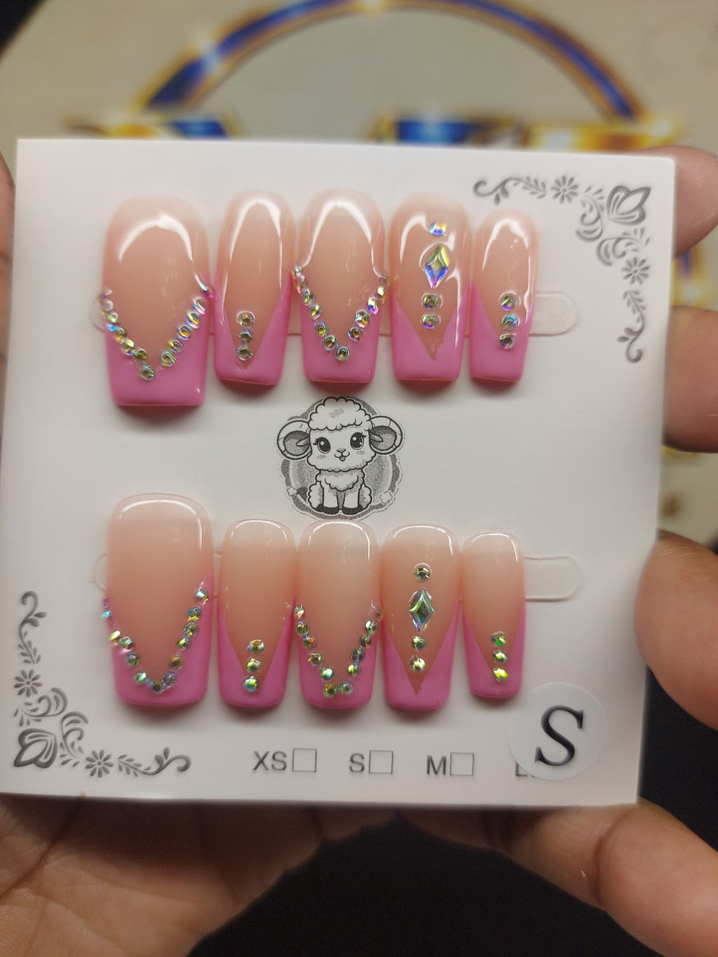 Pink diamond rhinestone nails close-up