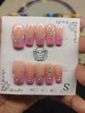 Pink diamond rhinestone nails close-up