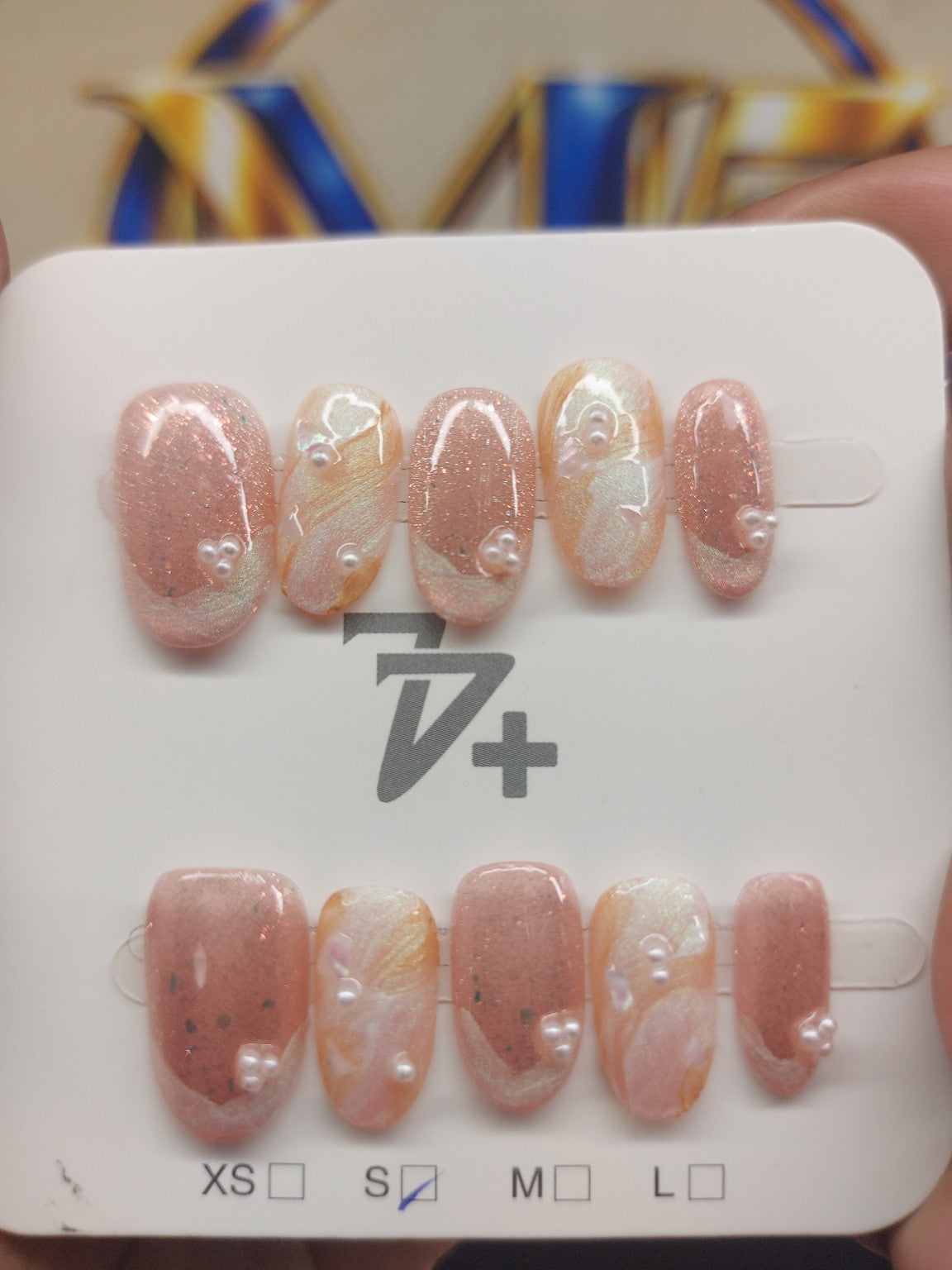 Rose gold pearl nails close up
