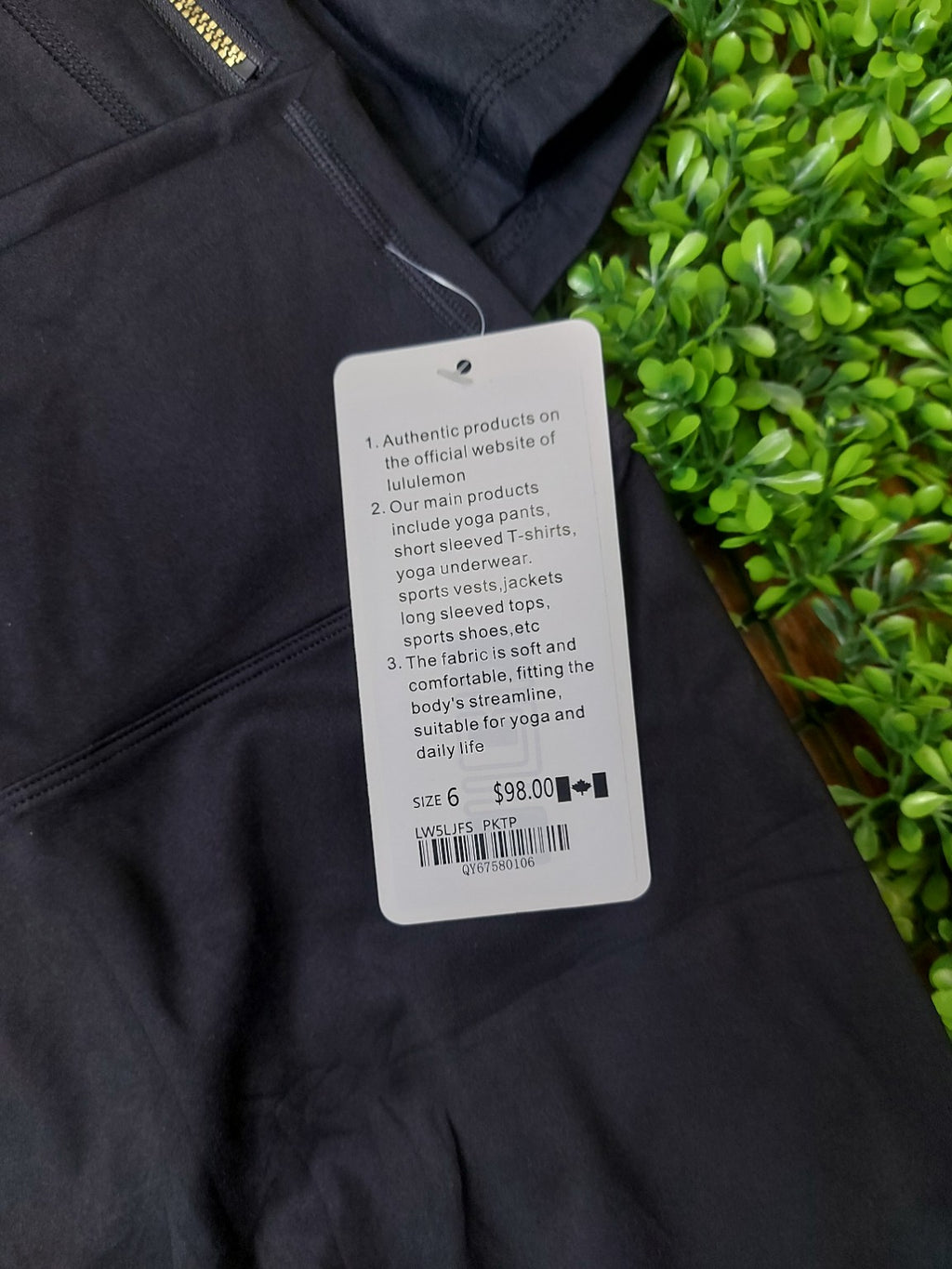 Black jacket with gold zippers and matching biker shorts, original product photo