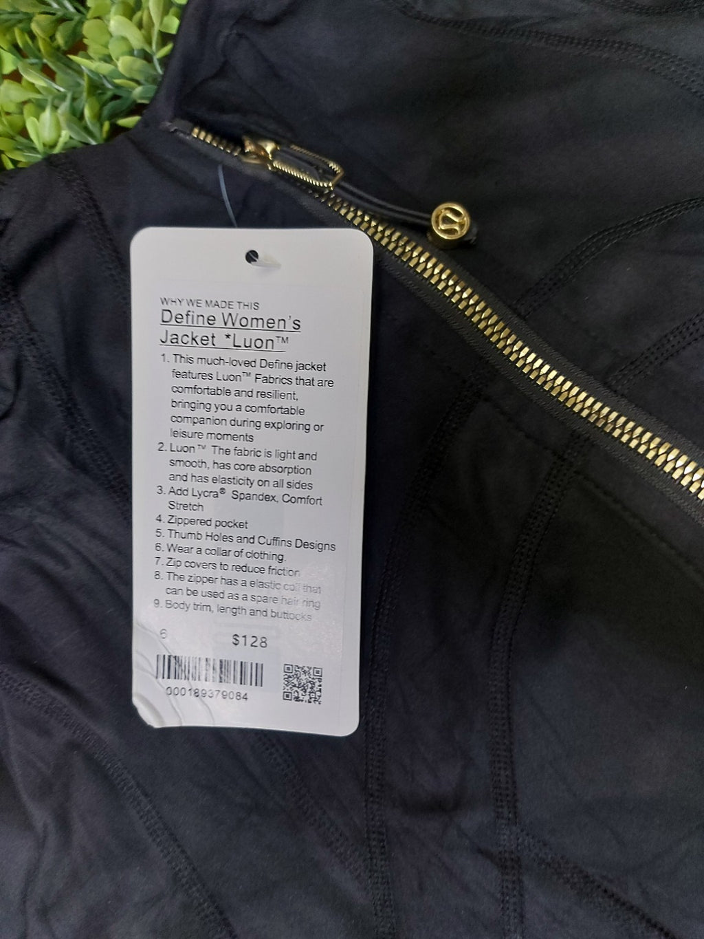Black jacket with gold zippers and matching biker shorts, original product photo