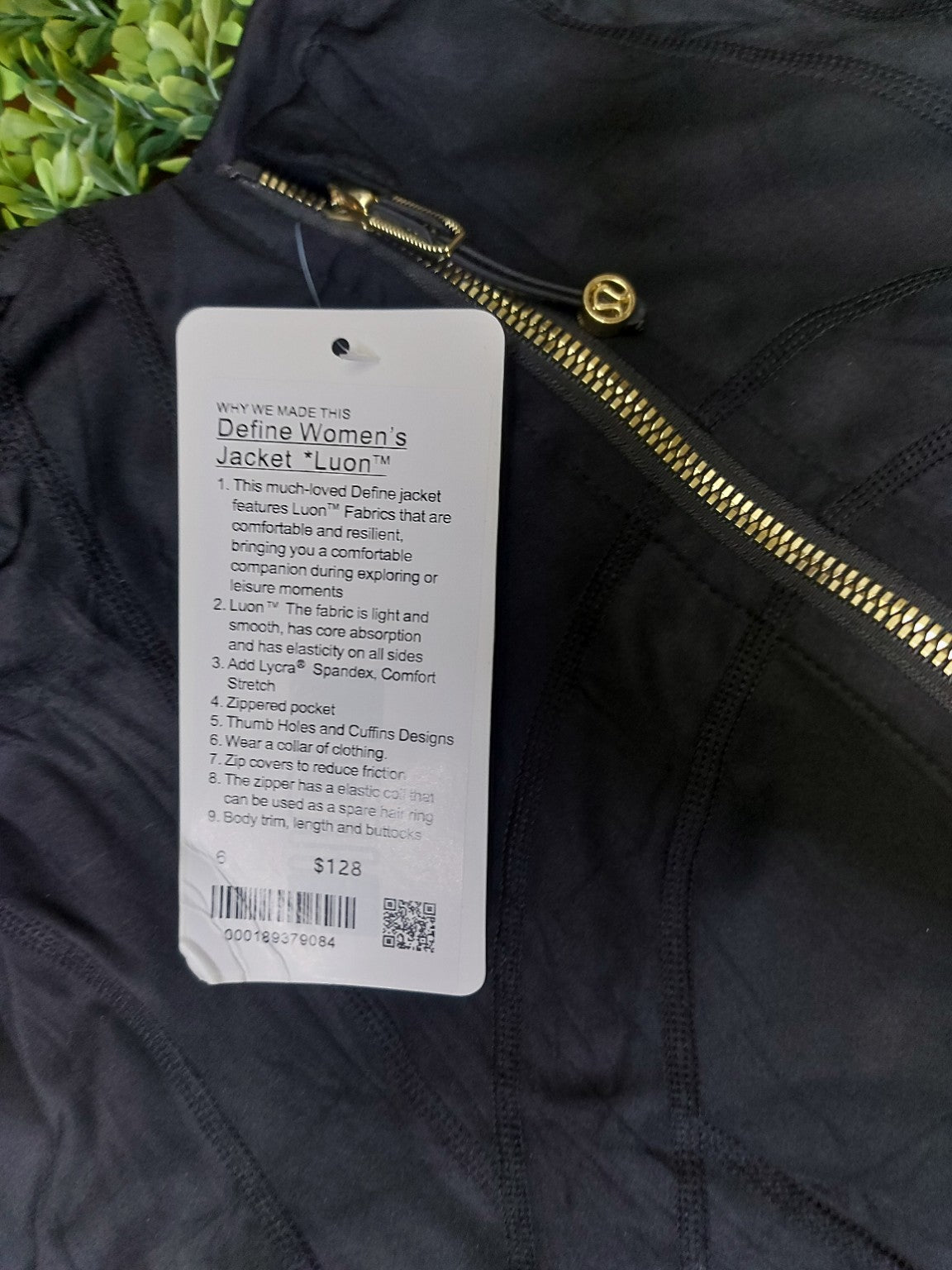 Black jacket with gold zippers and matching biker shorts, original product photo