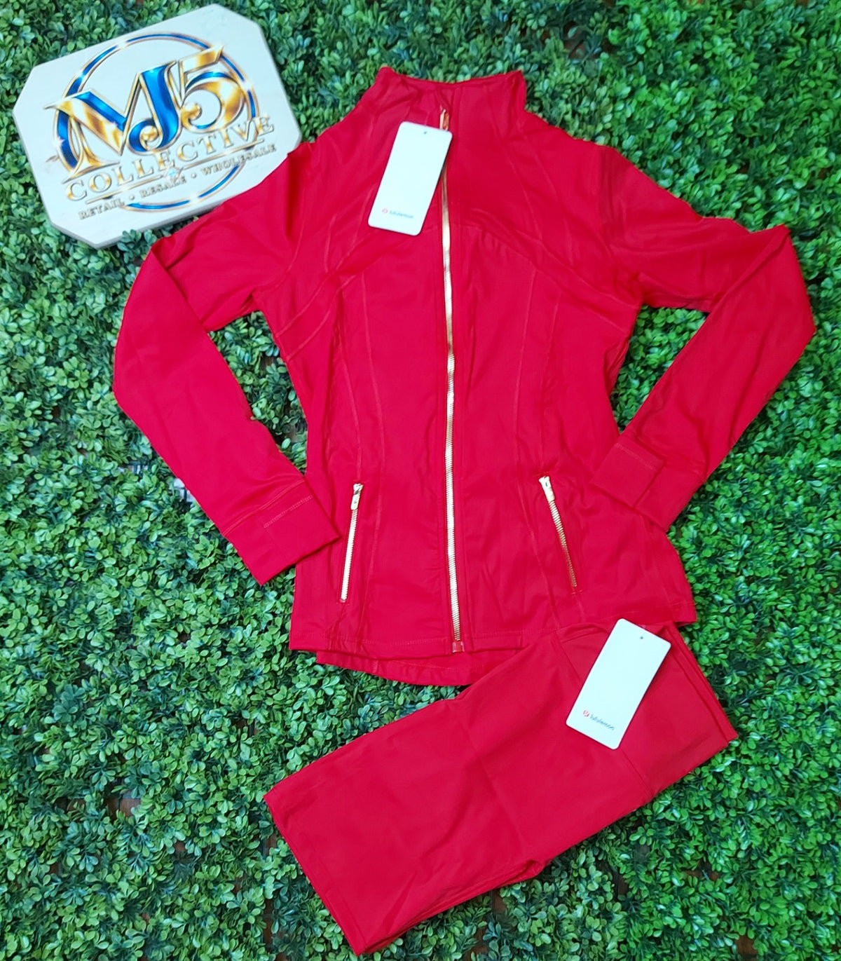 Red jacket with gold zippers and matching leggings, original product photo