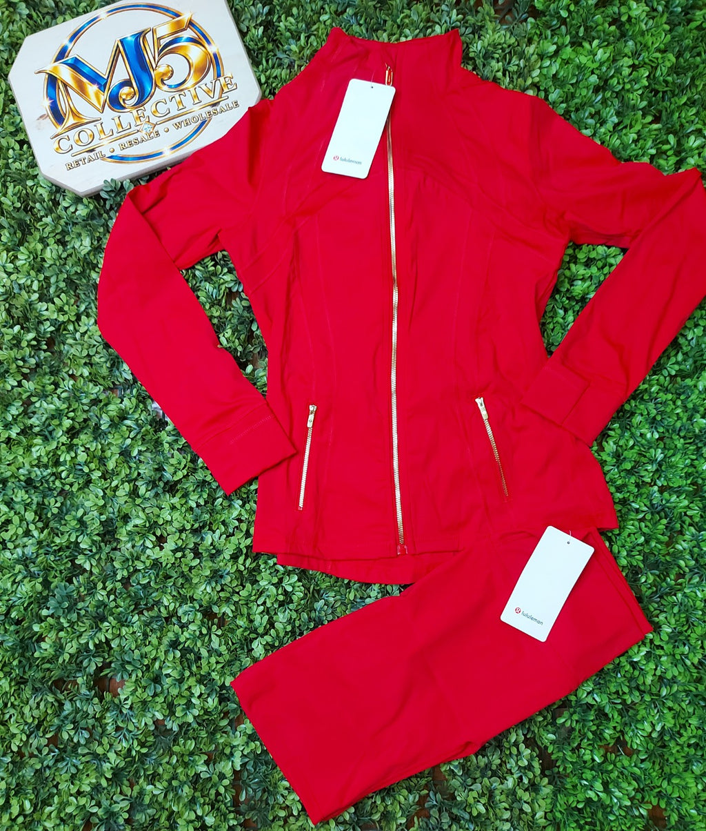 Red jacket with gold zippers and matching leggings, original product photo
