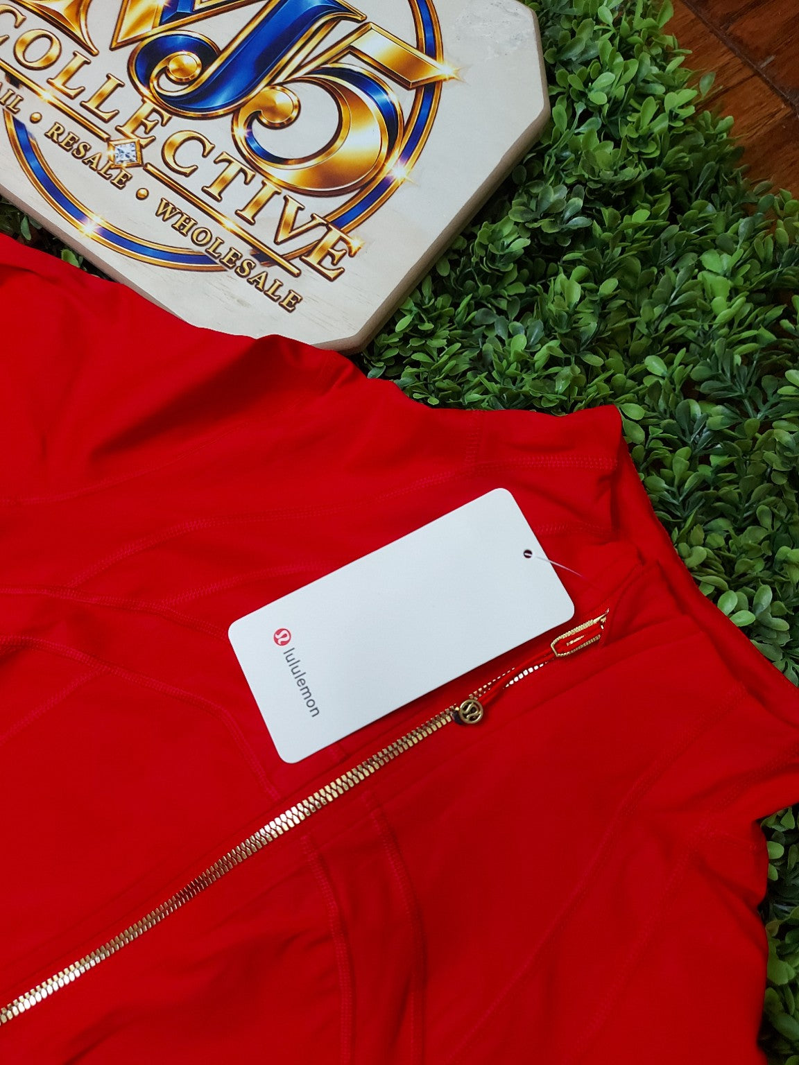 Red jacket with gold zippers and matching leggings, original product photo