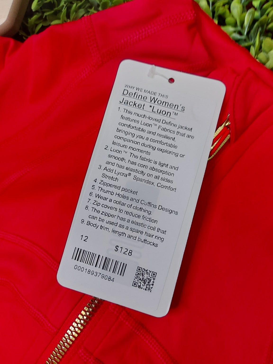 Red jacket with gold zippers and matching leggings, original product photo