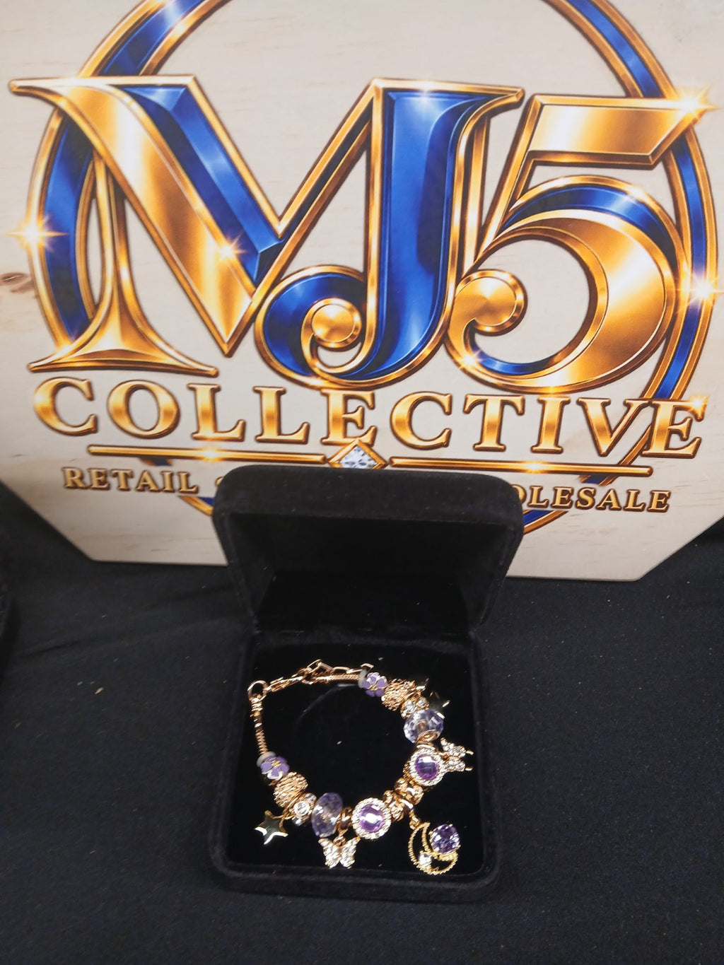 Lavender Starlight Charm Bracelet displayed in jewelry box