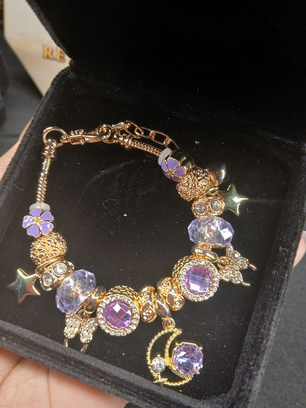 Lavender Starlight Charm Bracelet close-up of purple and gold charms