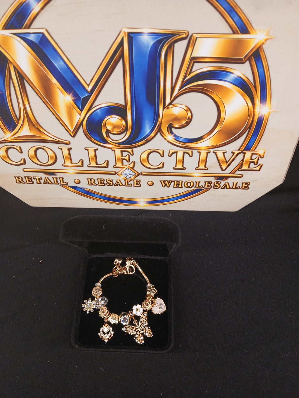 Golden Butterfly Wishes Charm Bracelet displayed in jewelry box