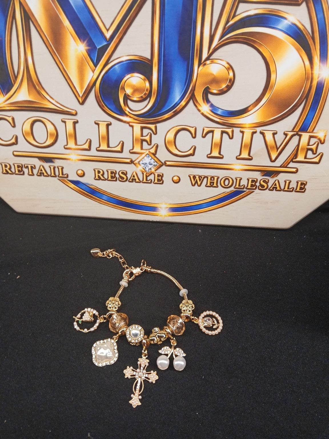 Golden Pearl Grace Charm Bracelet displayed with MJ5 branding