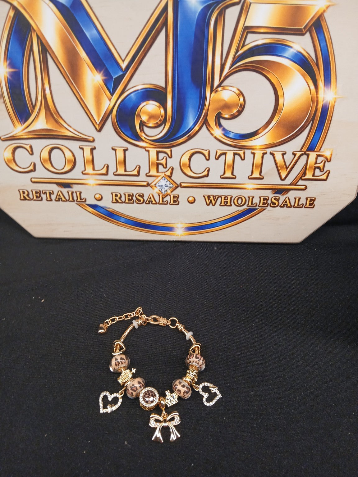 Golden Leopard Bow Charm Bracelet full display with MJ5 branding