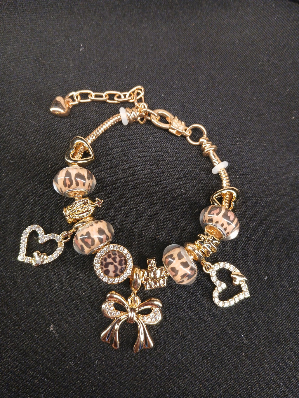 Golden Leopard Bow Charm Bracelet close-up with leopard-print beads and gold bow