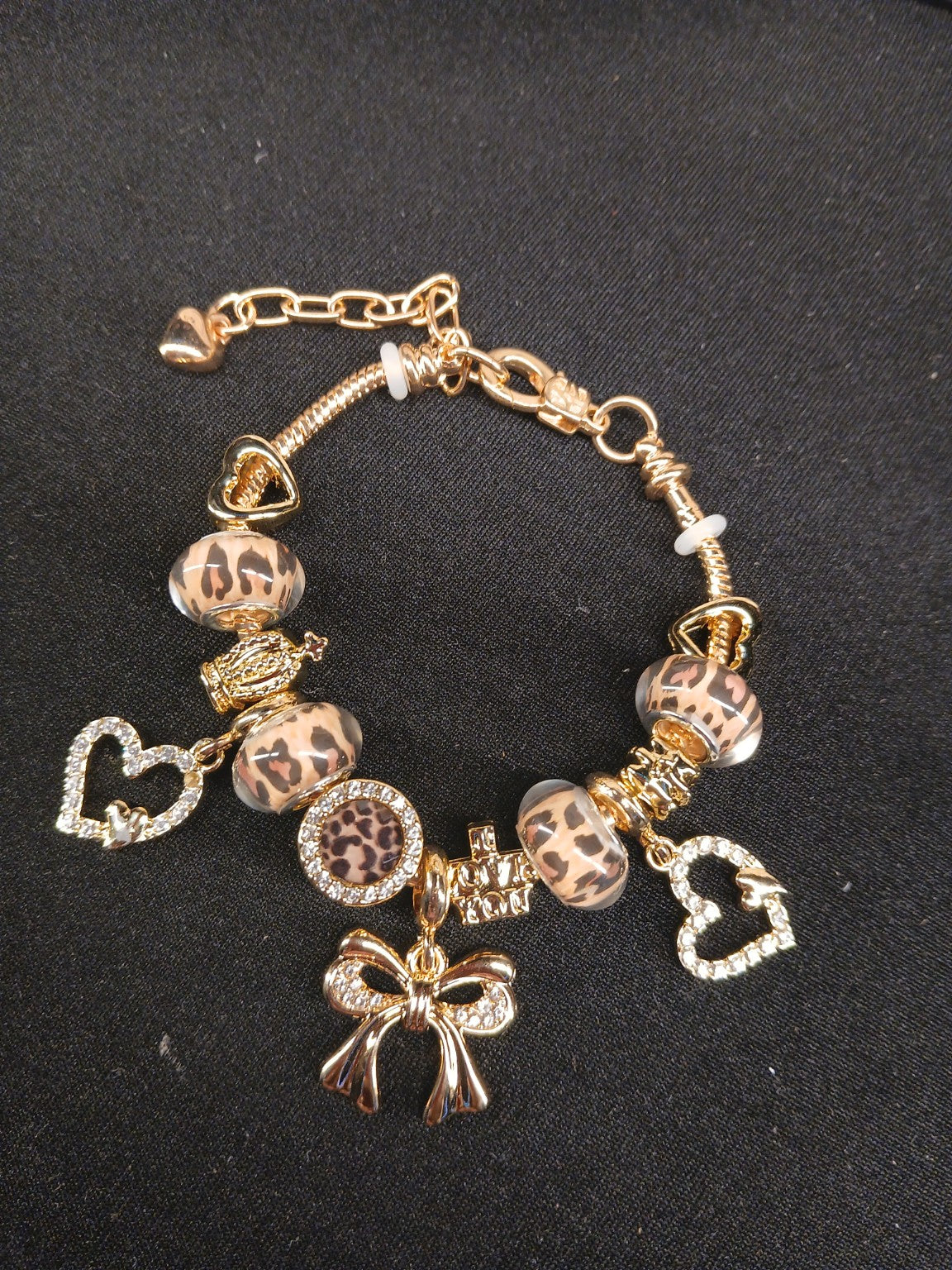 Golden Leopard Bow Charm Bracelet close-up with leopard-print beads and gold bow