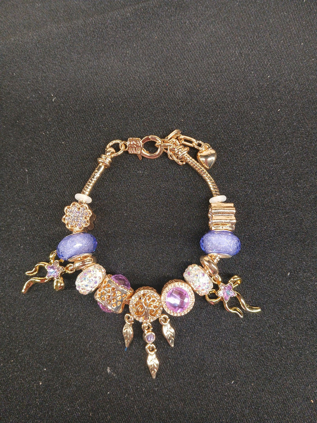 Violet Dreamcatcher Charm Bracelet close-up of lavender beads and gold charms