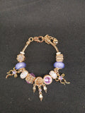 Violet Dreamcatcher Charm Bracelet close-up of lavender beads and gold charms