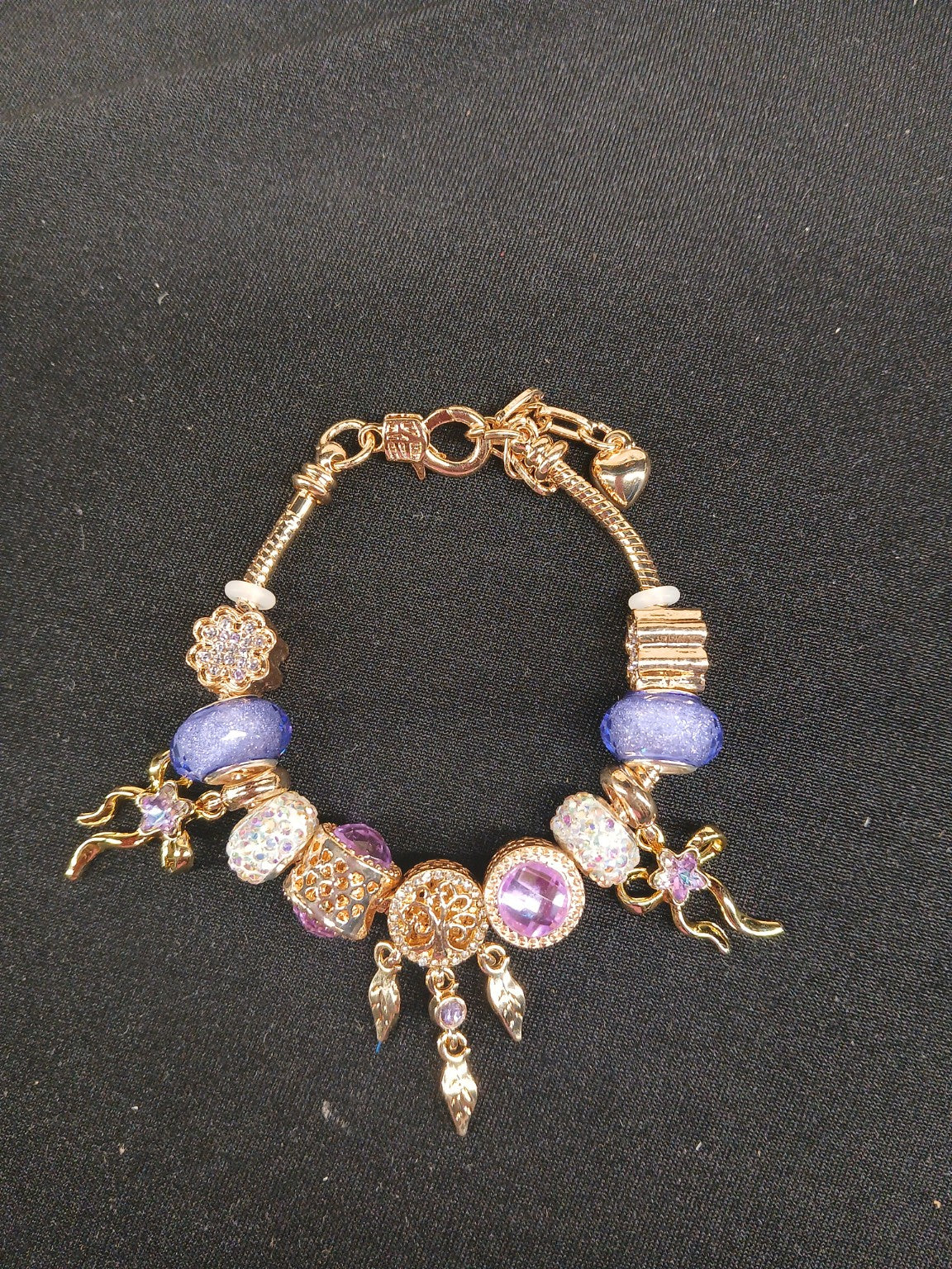 Violet Dreamcatcher Charm Bracelet close-up of lavender beads and gold charms