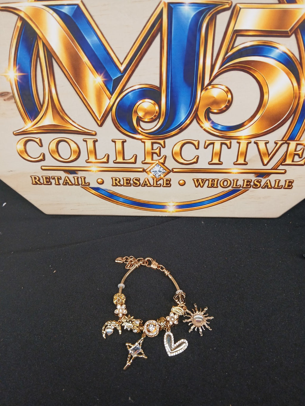 Golden Celestial Love Charm Bracelet full view with MJ5 Collective branding