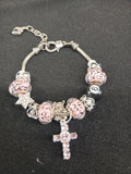 Pink Leopard Faith Charm Bracelet close-up with leopard beads and pink cross