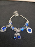 Sapphire Blue Cherry Sparkle Charm Bracelet close-up with blue cherries and silver charms