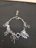 Midnight Bow Sparkle Charm Bracelet close-up with black bows and silver-tone charms