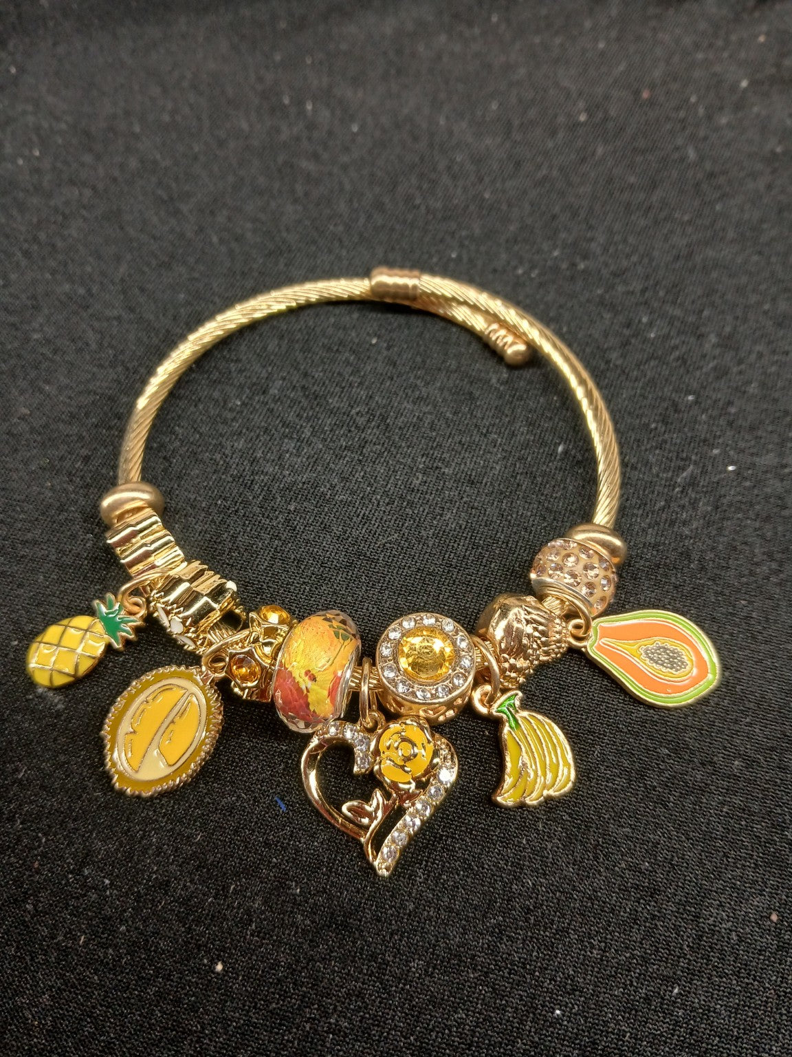 Tropical Golden Sunshine Charm Bracelet close-up showing fruit and yellow rose charms