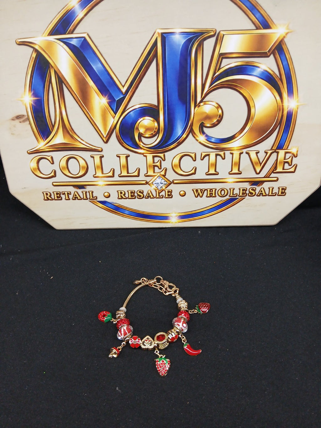 Full view strawberry spice charm bracelet