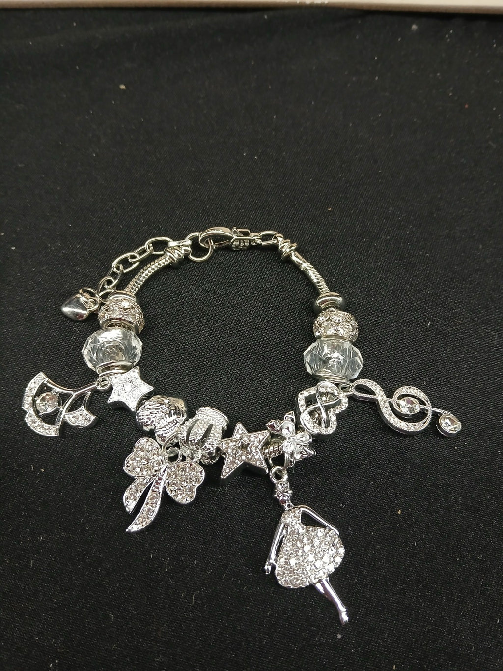 Close-up silver music and dance bracelet