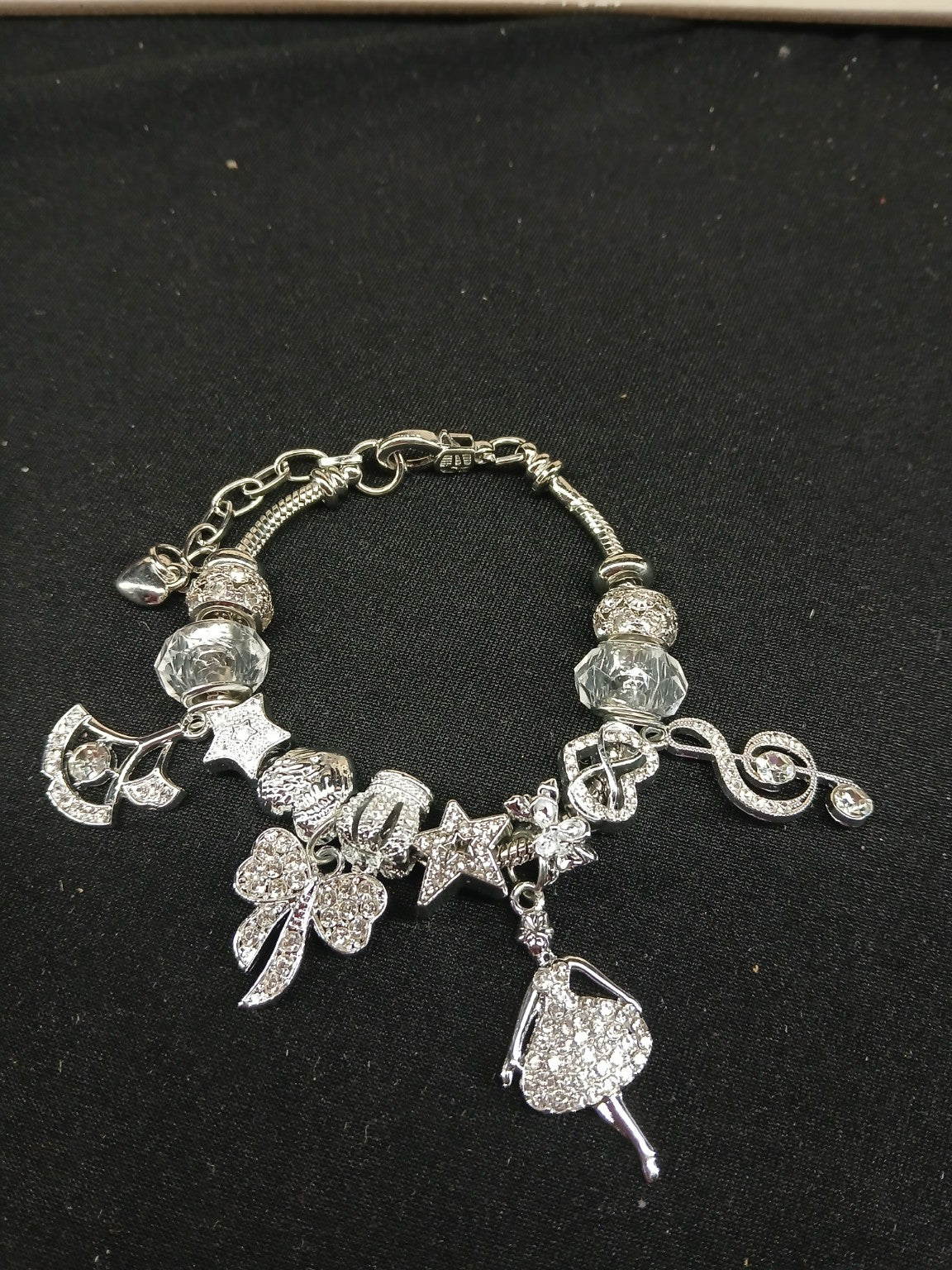 Close-up silver music and dance bracelet