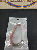 Pink white and gray beaded bracelet close-up