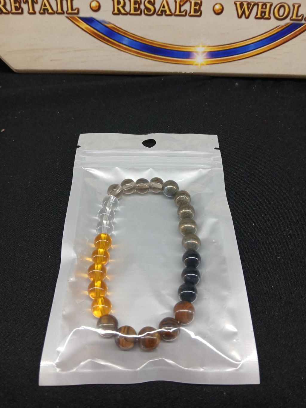 Amber clear and earth-tone beaded bracelet closeup
