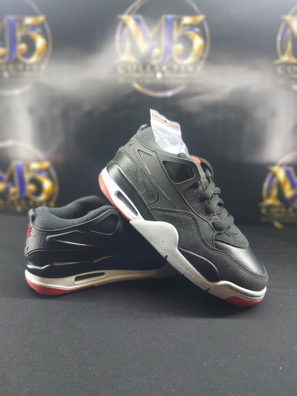 Air Jordan 4 RM GS Black Varsity Red Wolf Grey detail view