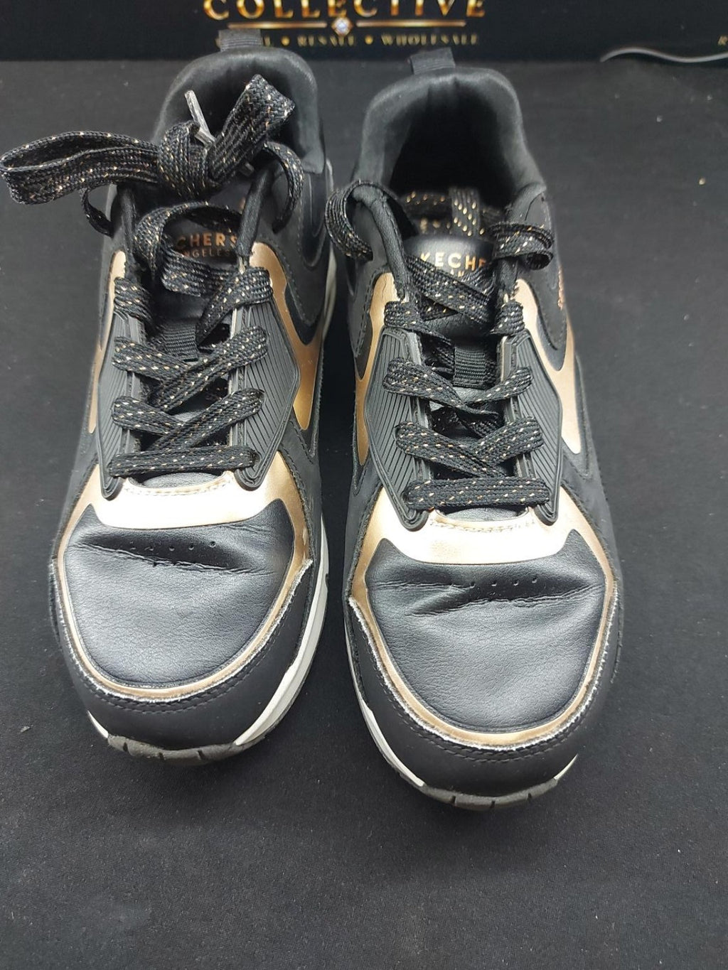 Skechers black gold actual original photo 1